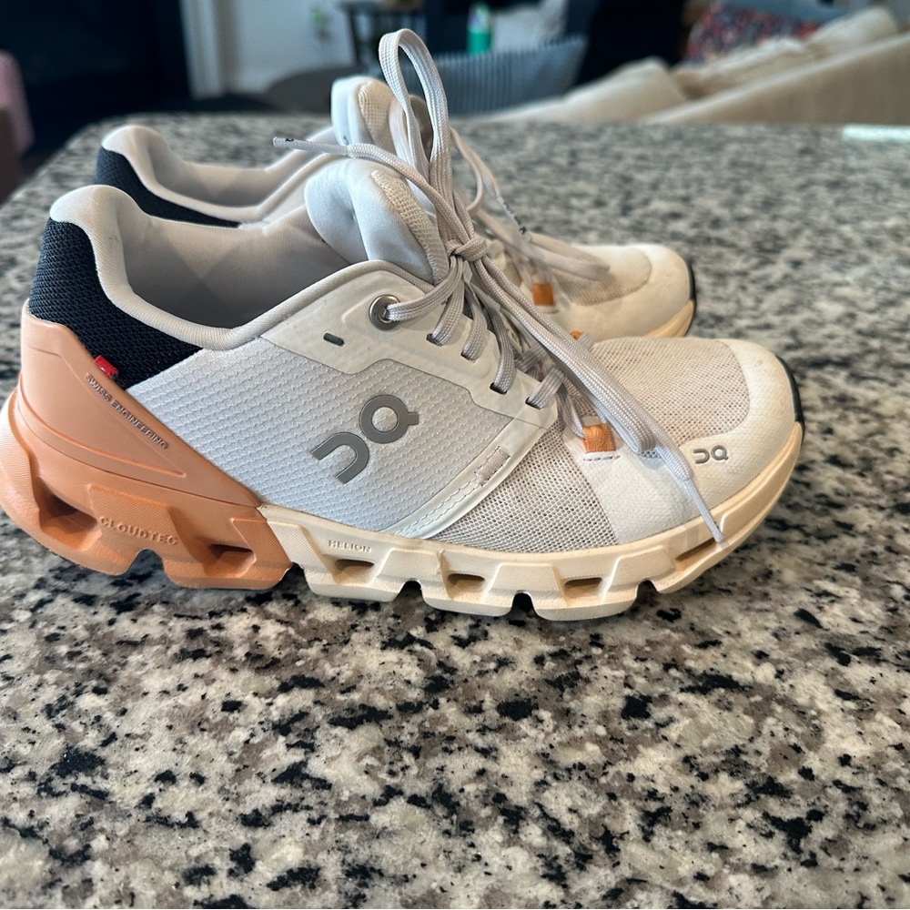 On Running White and Orange Sneakers